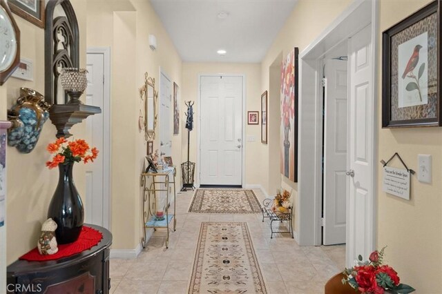 corridor featuring light tile patterned floors