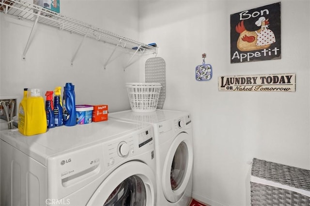 laundry area with washing machine and dryer