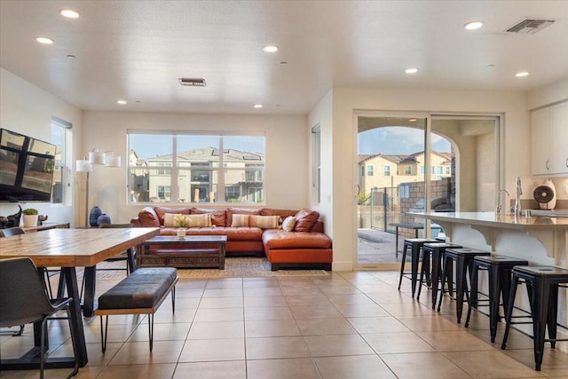 living room with light tile patterned floors