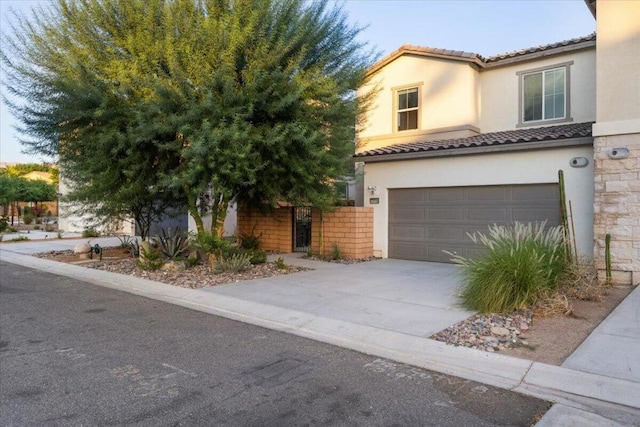 view of front of property with a garage