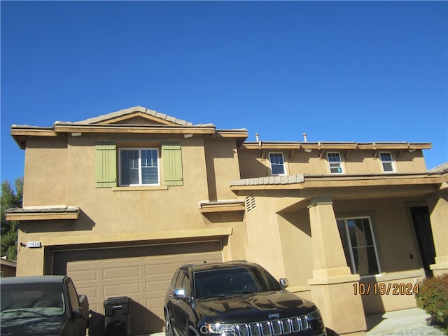 view of front of property with a garage