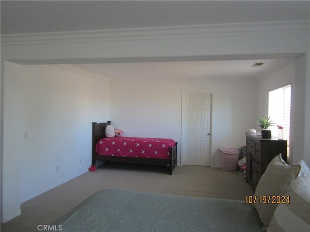 carpeted bedroom featuring ornamental molding