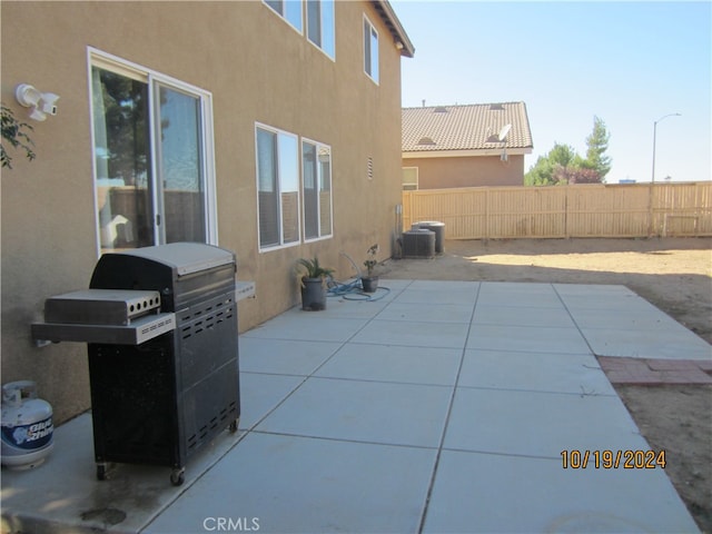 view of patio / terrace with area for grilling and central AC unit