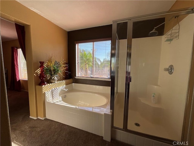 bathroom with shower with separate bathtub