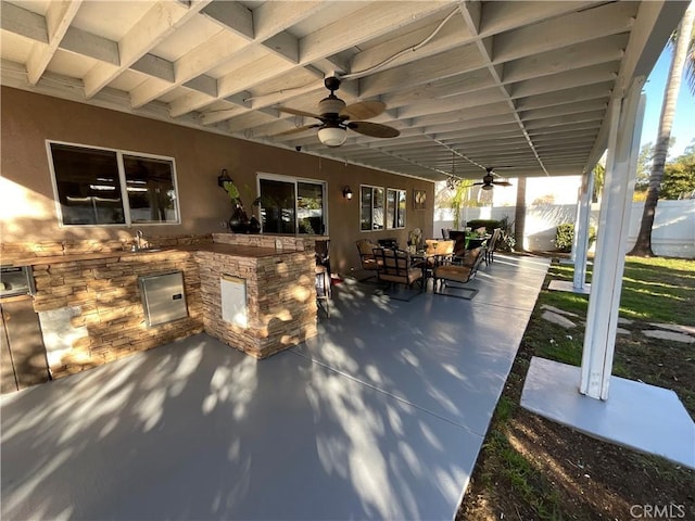 view of patio featuring ceiling fan