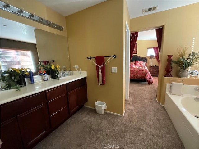 bathroom with a bath and vanity