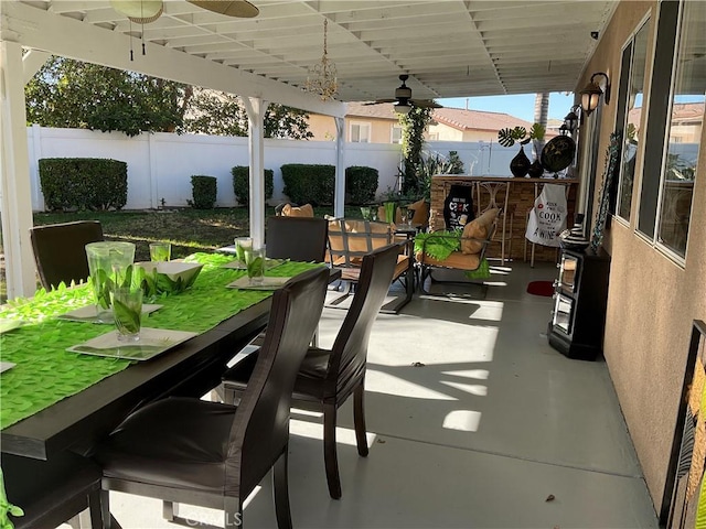 view of patio / terrace featuring exterior bar and ceiling fan