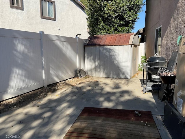 view of patio / terrace with a storage unit