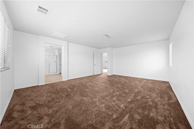 unfurnished room featuring carpet