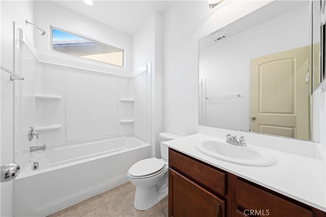 full bathroom featuring toilet, tile patterned floors, vanity, and bathing tub / shower combination