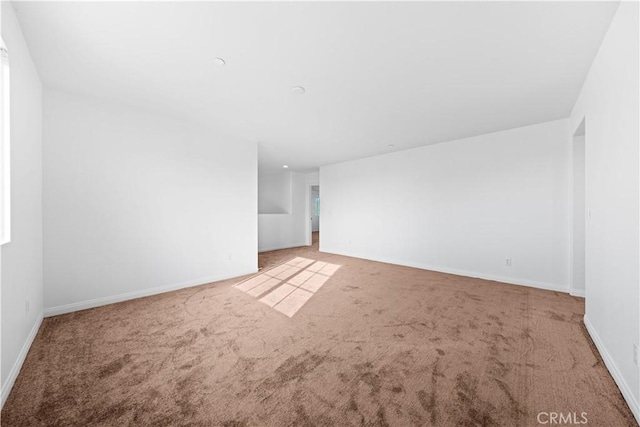 unfurnished room featuring carpet floors