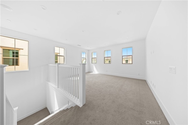 empty room with light colored carpet