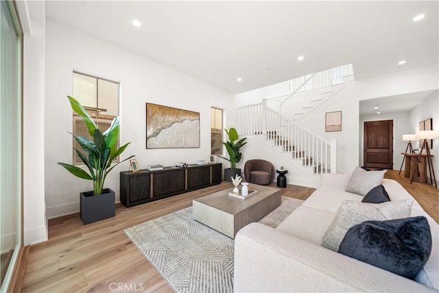 living room featuring light hardwood / wood-style floors and a wealth of natural light