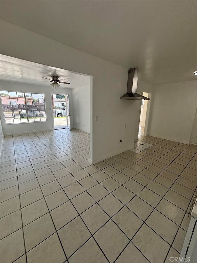 spare room featuring light tile patterned floors and ceiling fan