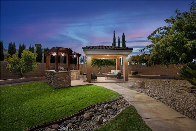 exterior space with outdoor lounge area, a patio, a pergola, and area for grilling