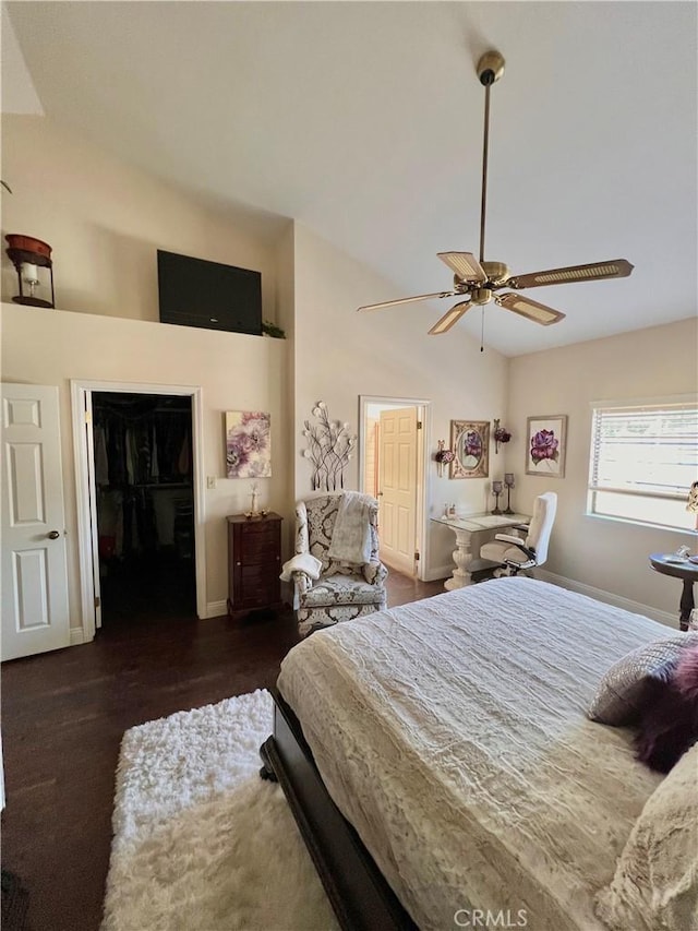 bedroom featuring ceiling fan, a closet, dark wood-type flooring, and vaulted ceiling