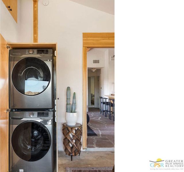 laundry room with stacked washer / drying machine