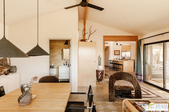 dining room with ceiling fan, separate washer and dryer, and vaulted ceiling