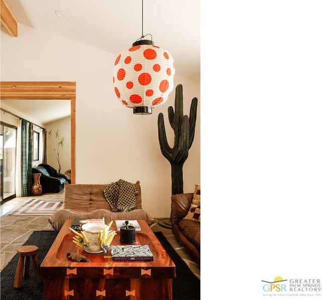 living room featuring lofted ceiling