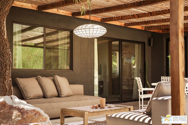 view of patio with outdoor lounge area and a pergola