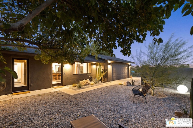 view of front of property with a garage