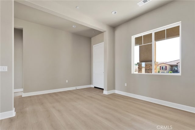 empty room with light hardwood / wood-style floors