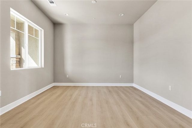 unfurnished room featuring light hardwood / wood-style floors