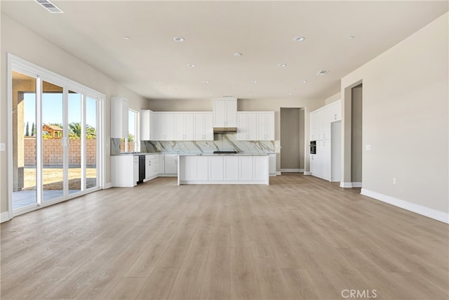 unfurnished living room with sink and light wood-type flooring