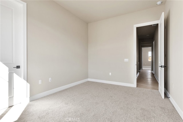 spare room featuring carpet floors