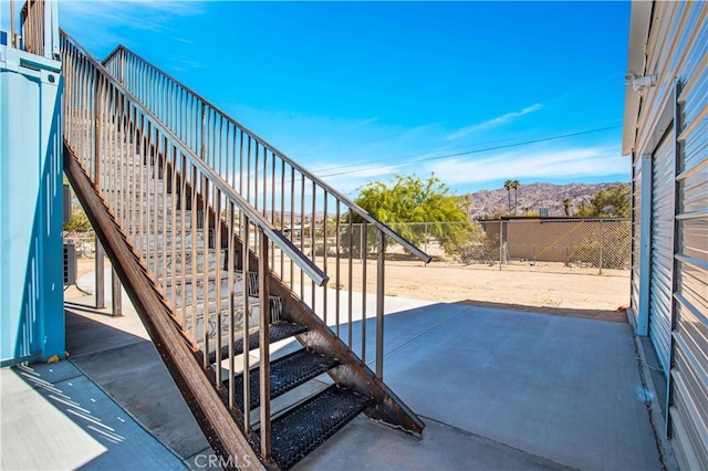 view of patio / terrace featuring a mountain view