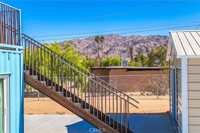 exterior space with a mountain view and a patio