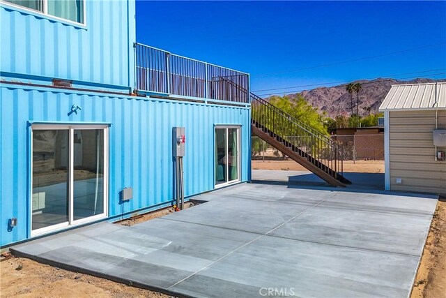 view of patio / terrace featuring a mountain view