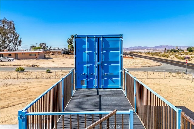 entry to storm shelter with a mountain view