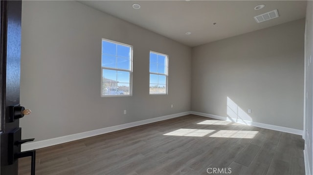 empty room featuring wood-type flooring