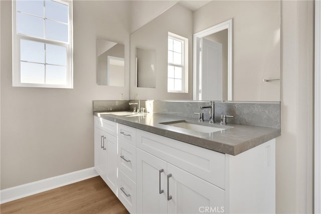 bathroom featuring vanity and hardwood / wood-style flooring