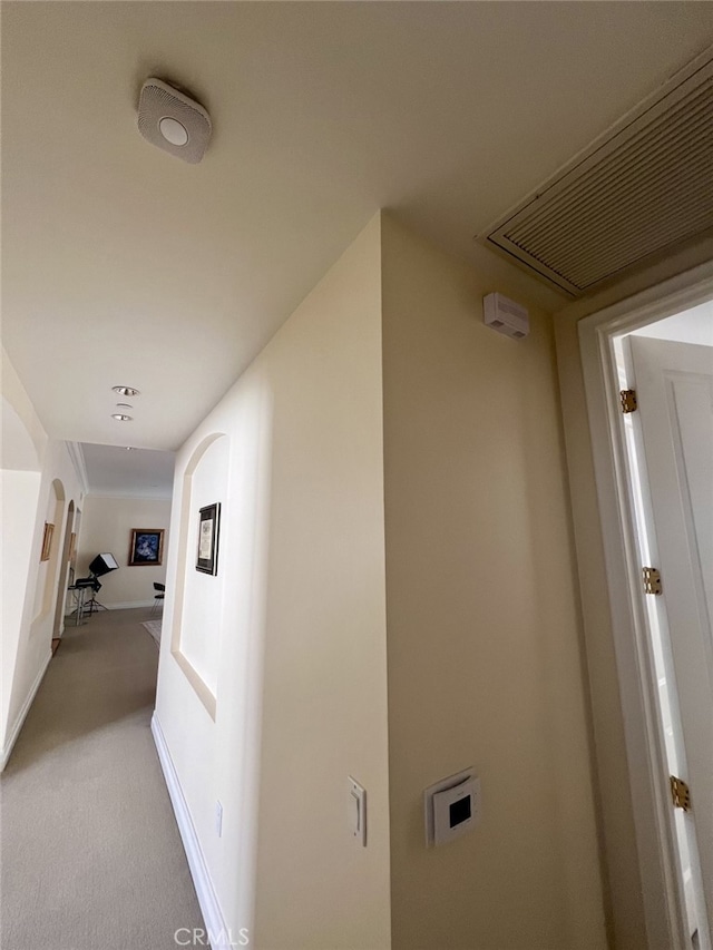11847 Gorham Ave Unit 403, Los Angeles, CA 90049 - hall with light colored carpet, visible vents, and arched walkways