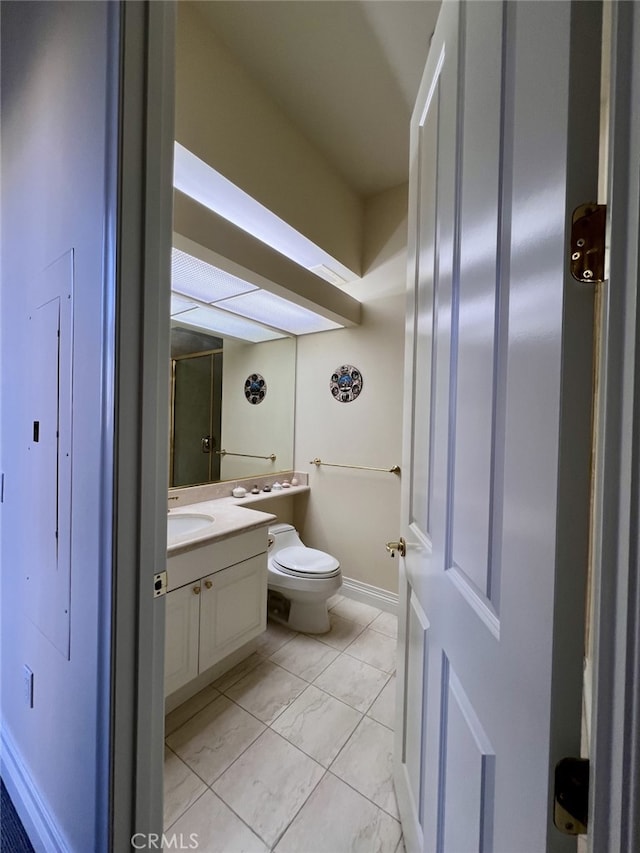11847 Gorham Ave Unit 403, Los Angeles, CA 90049 - bathroom featuring vanity, toilet, baseboards, and marble finish floor