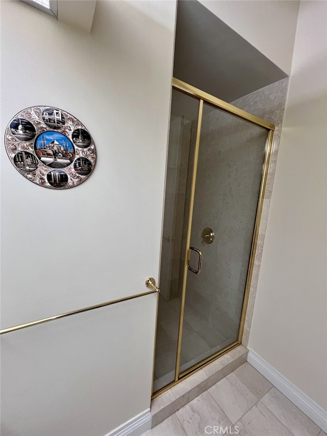 11847 Gorham Ave Unit 403, Los Angeles, CA 90049 - full bathroom featuring a stall shower and baseboards