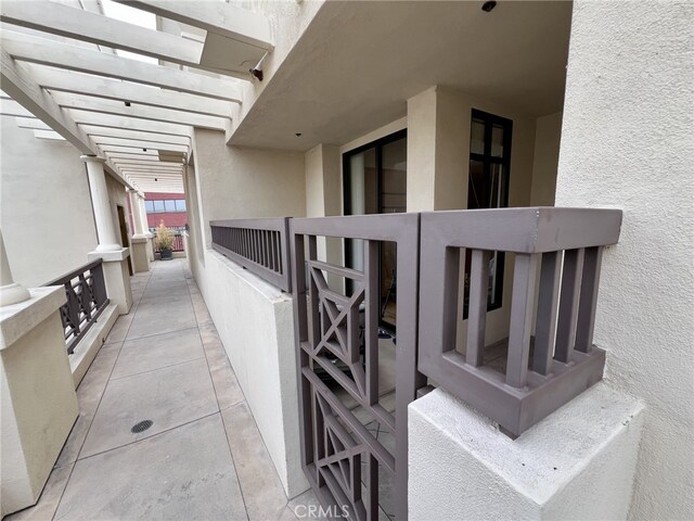 11847 Gorham Ave Unit 403, Los Angeles, CA 90049 - view of property exterior with stucco siding and a pergola