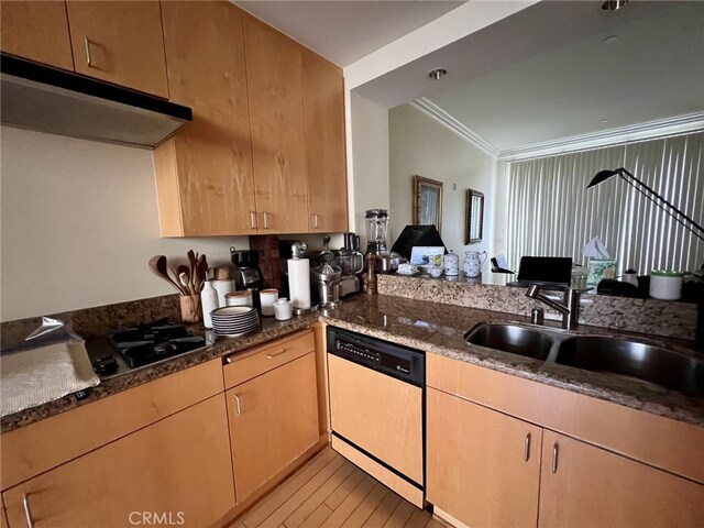11847 Gorham Ave Unit 403, Los Angeles, CA 90049 - kitchen featuring under cabinet range hood, dishwasher, ornamental molding, a sink, and dark stone countertops