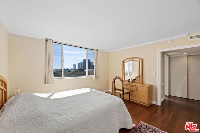 bedroom featuring dark hardwood / wood-style floors and ornamental molding