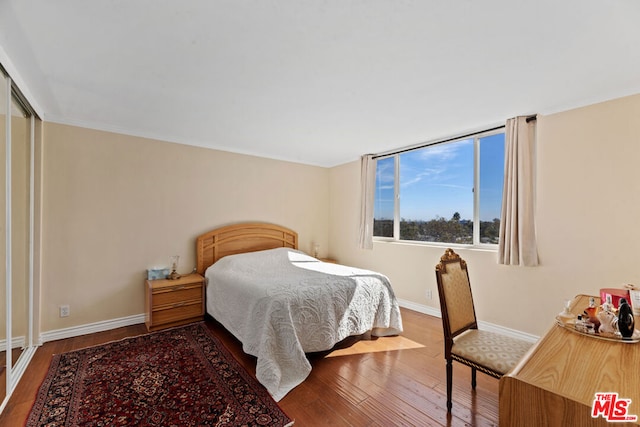 bedroom featuring hardwood / wood-style flooring