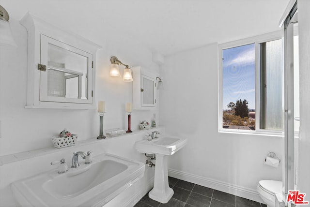 bathroom featuring tile patterned floors and toilet