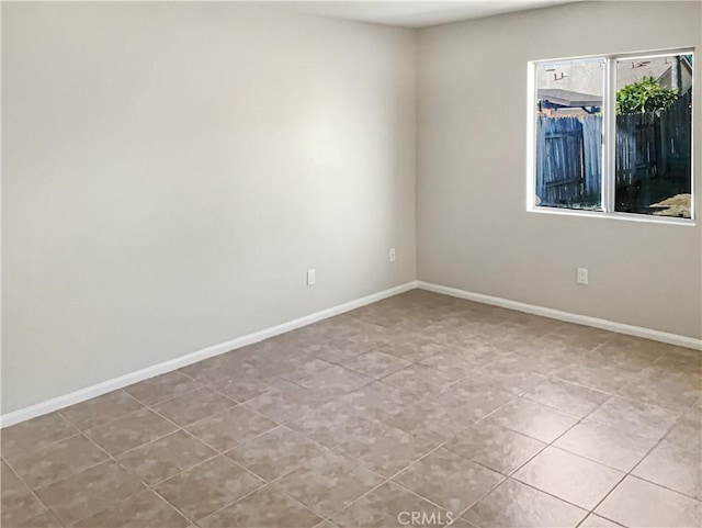 empty room featuring light tile patterned flooring