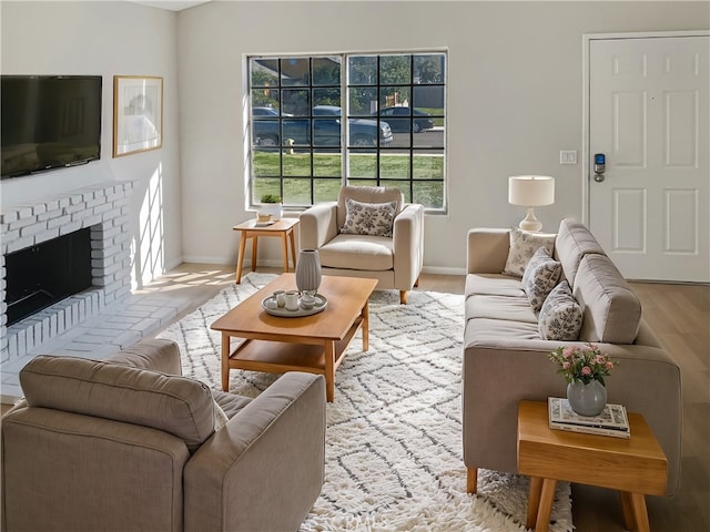 living room with a fireplace and light hardwood / wood-style flooring