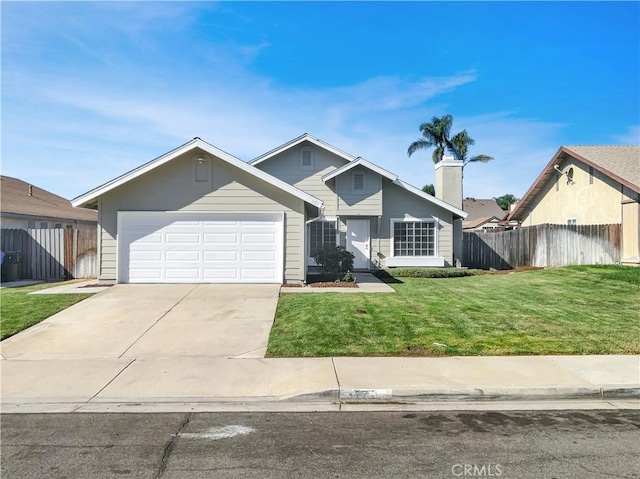 view of front of home with a garage and a front yard