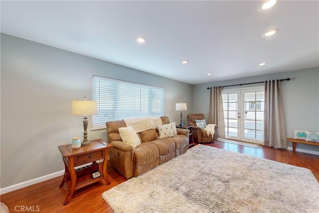 living room featuring dark hardwood / wood-style floors and french doors