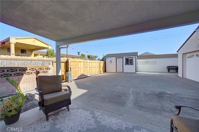 view of patio / terrace with a shed