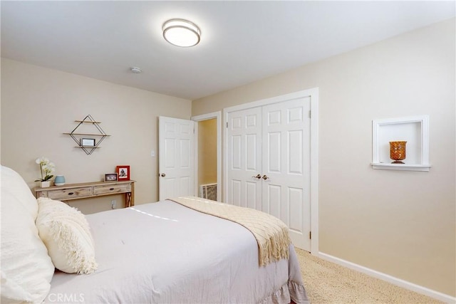 carpeted bedroom featuring a closet