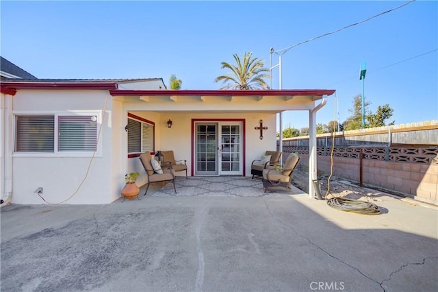 doorway to property featuring a patio